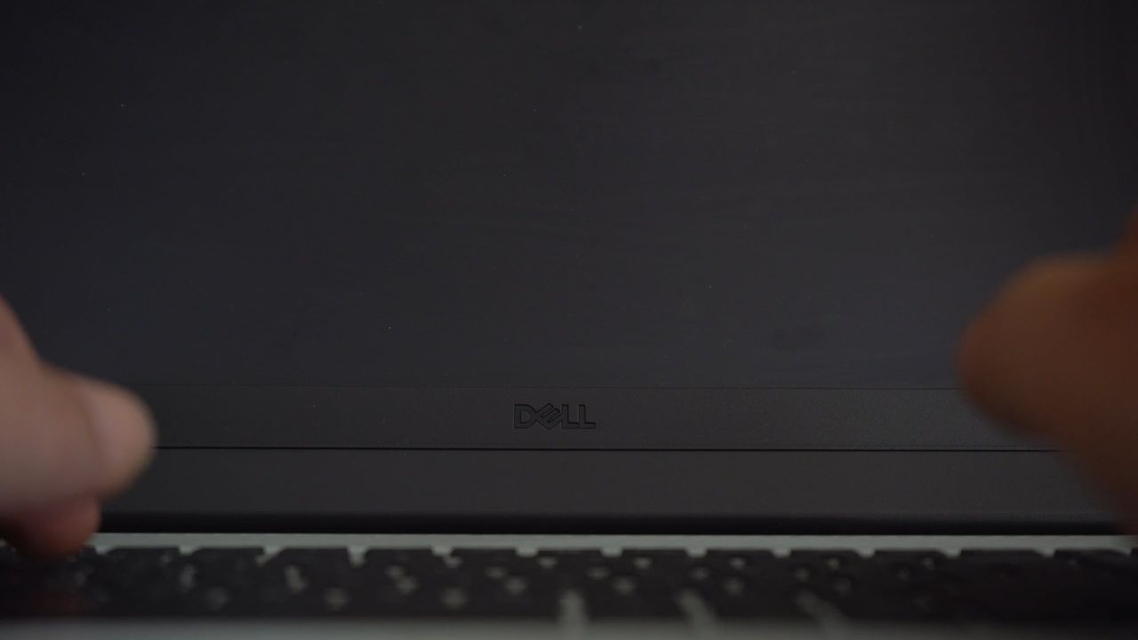 Close-up of a programmer typing code on a laptop